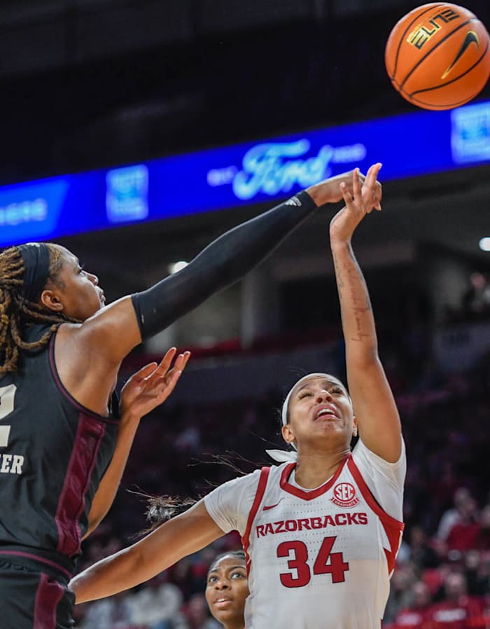 Arkansas Razorbacks Chrissy Carr has shot blcked by Texas A&M's Janiah Barker on Sunday.